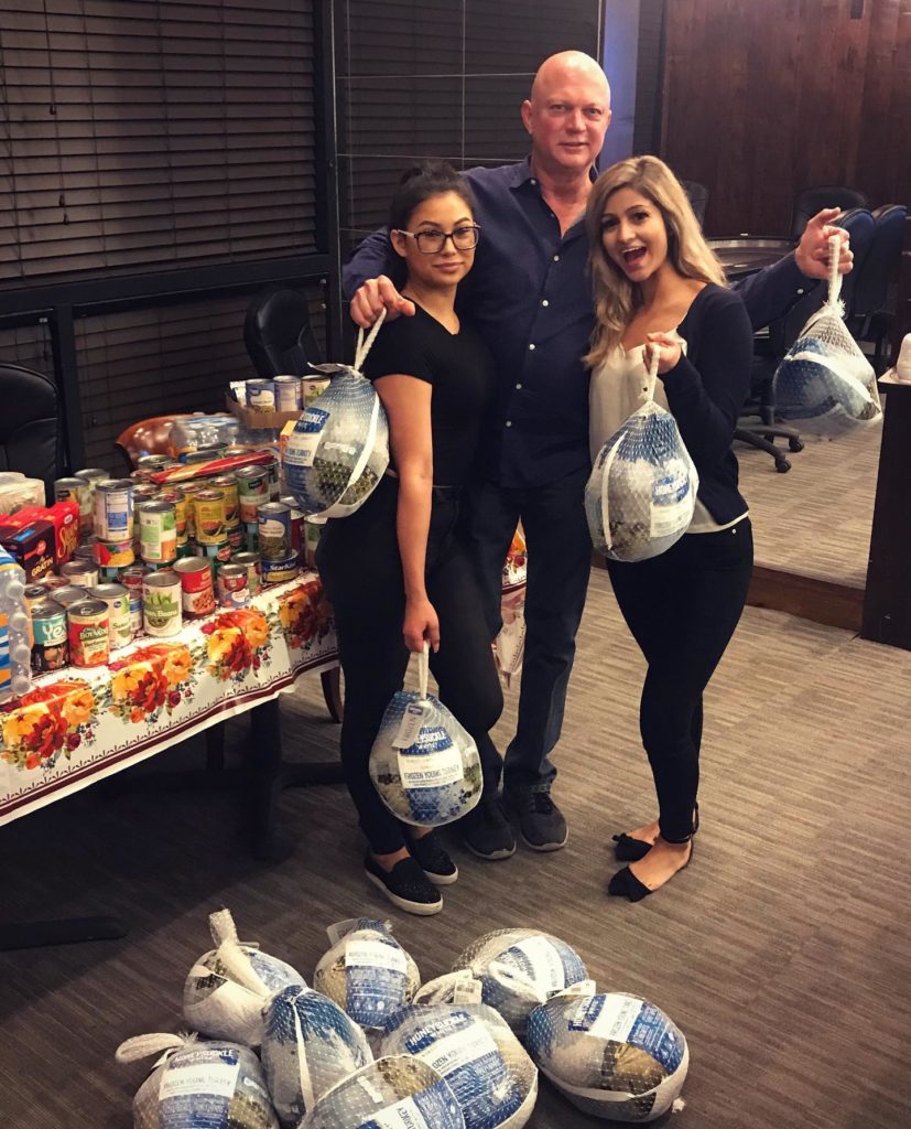 Gary poses with over $100 worth of turkey donations